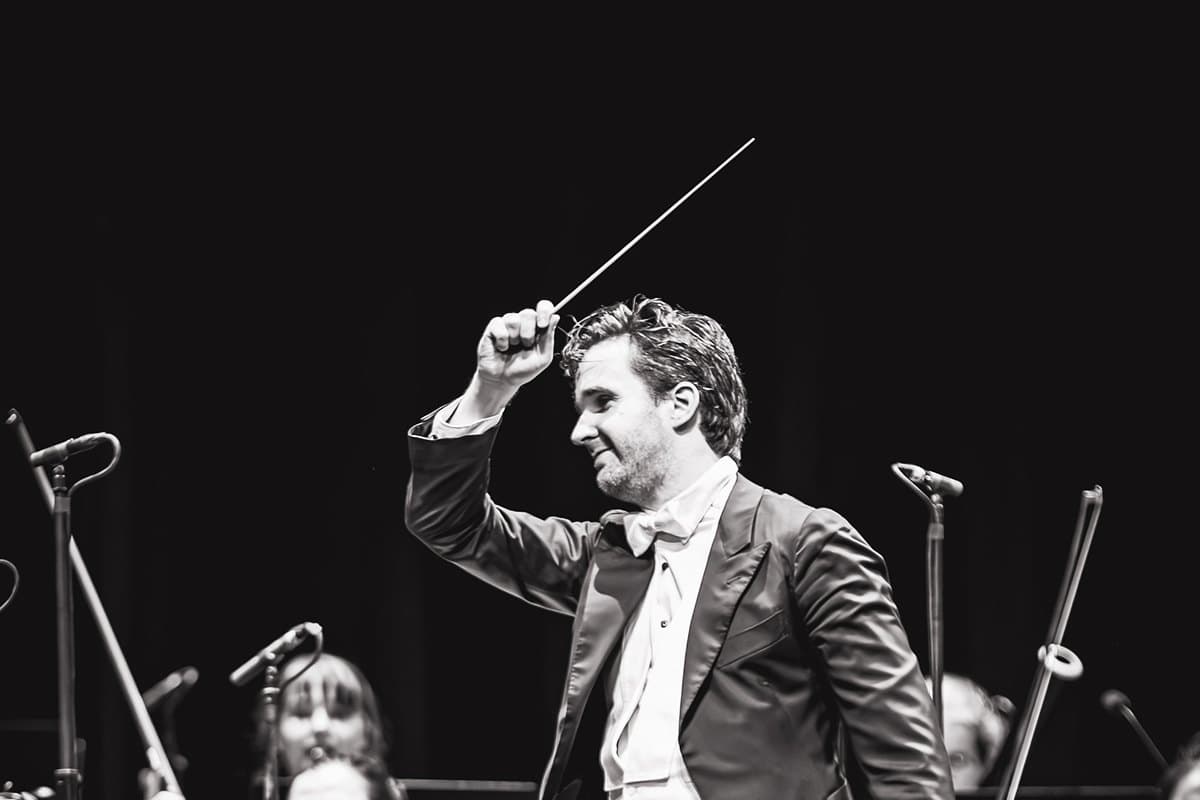 Conductor Sándor Károlyi leading the Schönbrunn Palace Orchestra Vienna