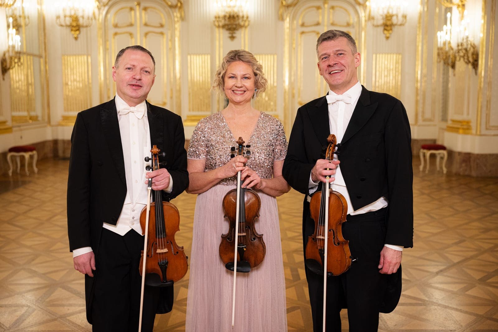 Schloss Schönbrunn Ensemble Vienna, as a trio of violins