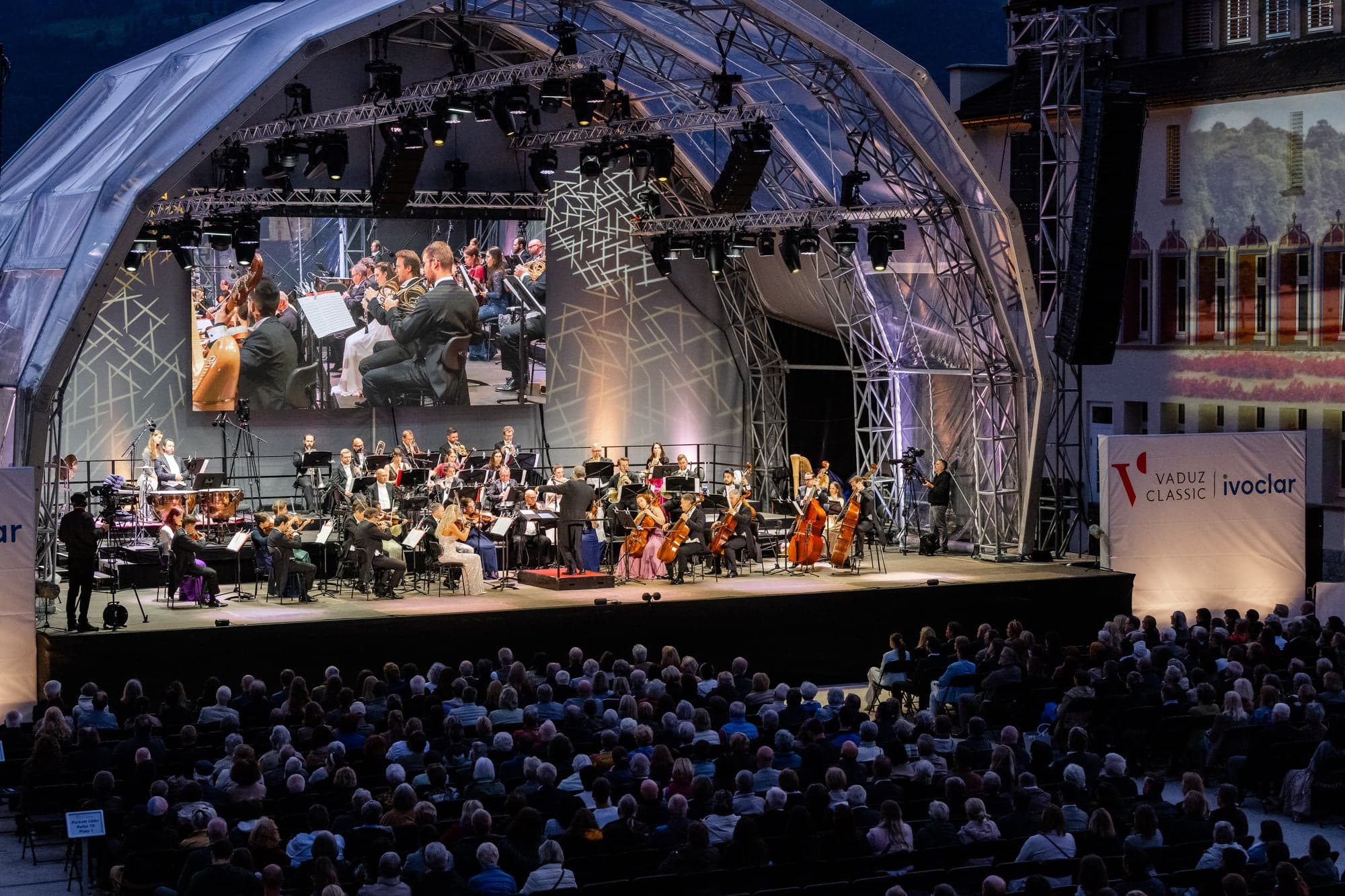 The orchestra on the open-air stage at night, Vaduz 2025